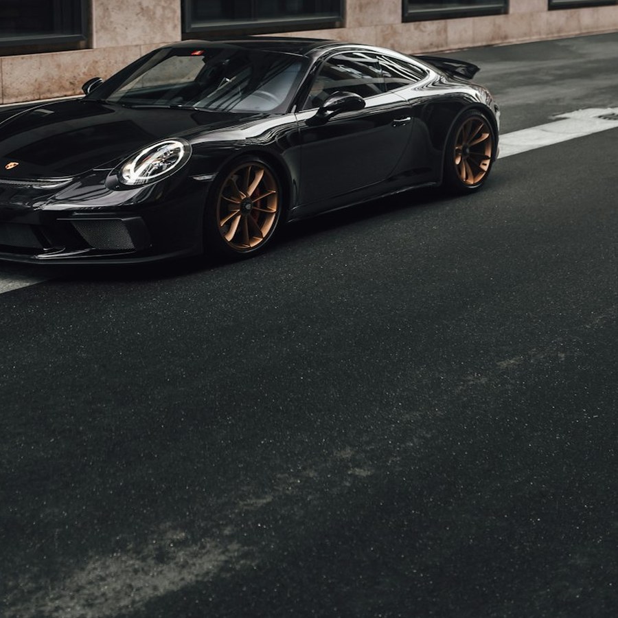 Black Porsche with restored alloy wheels