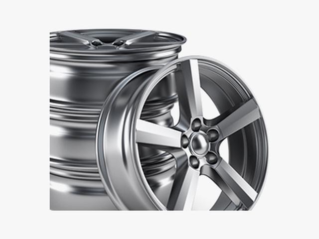 Buckled alloy wheel being straightened